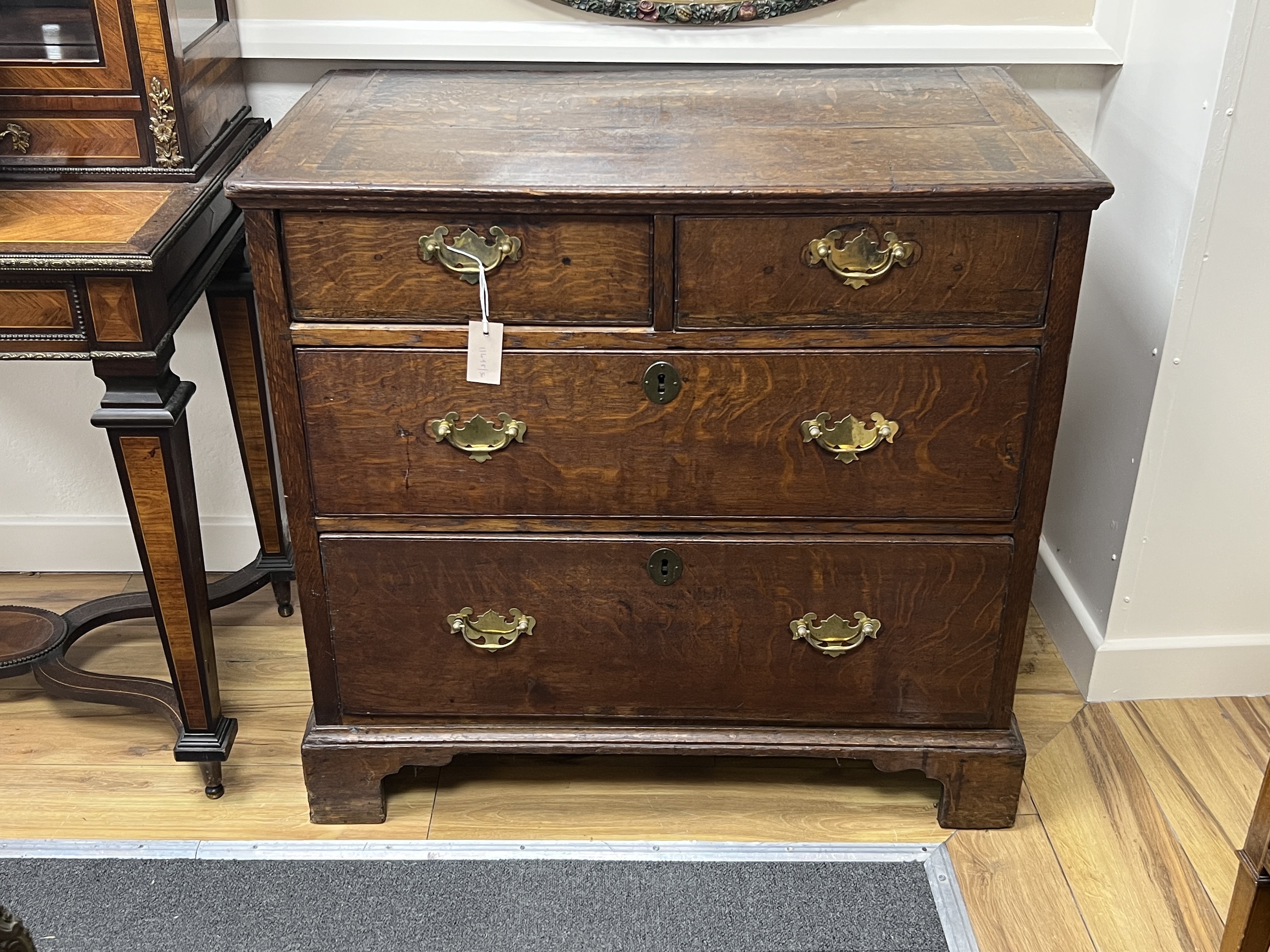 A George III provincial oak four drawer chest, width 90cm, depth 52cm, height 84cm